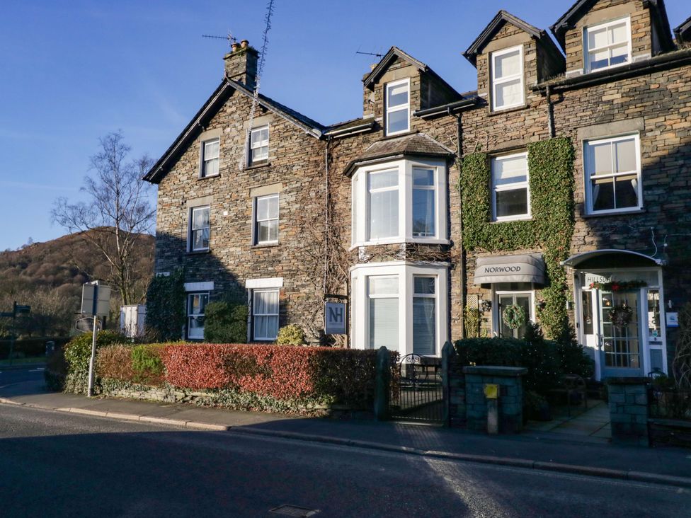 A house with windows and a sign at Norwood House in Ambleside