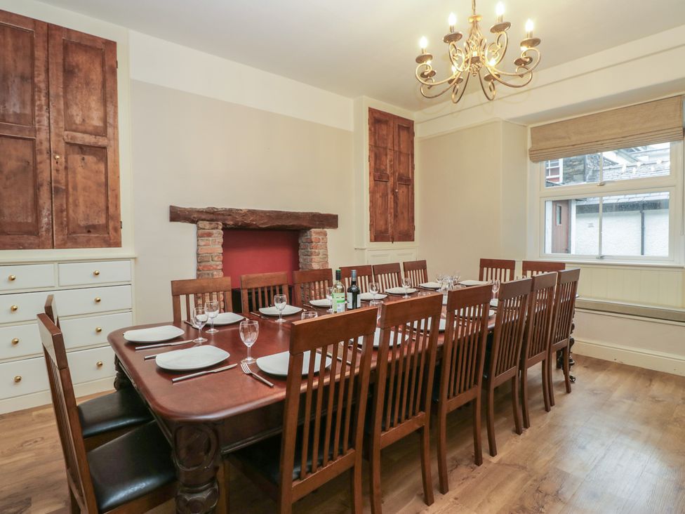 A dining room with a large table set for meals at Norwood House Ambleside
