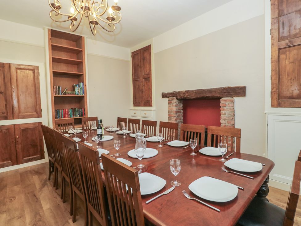 A dining room with a large table and chairs at Norwood House in Ambleside