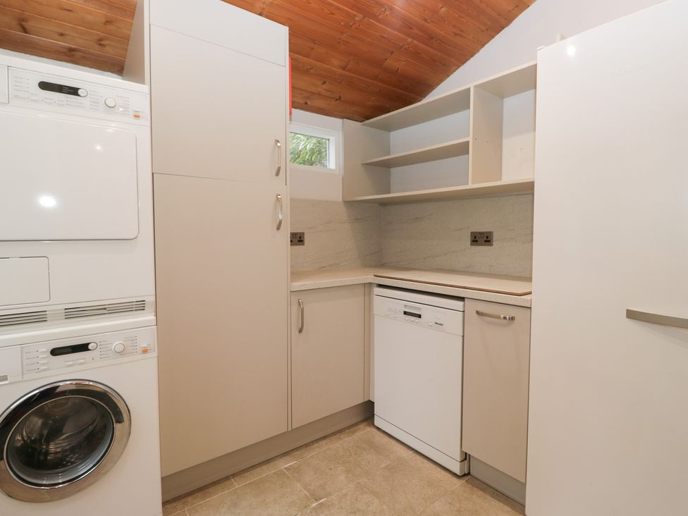 A kitchen with appliances and cabinets at Norwood House in Ambleside