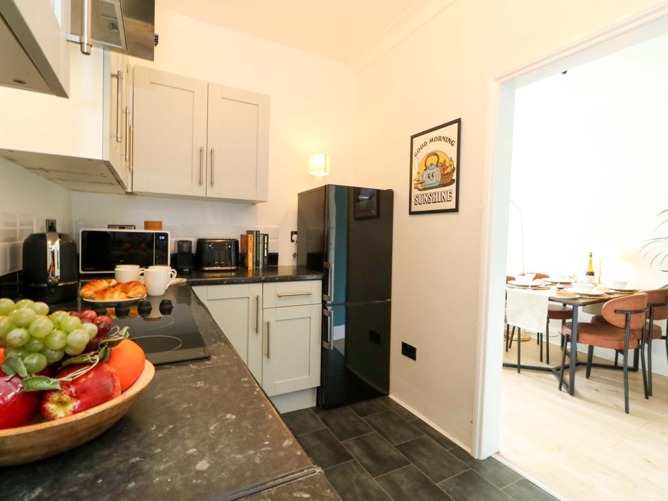 A kitchen with appliances and fruit bowl at Seagull & Chips in Weymouth