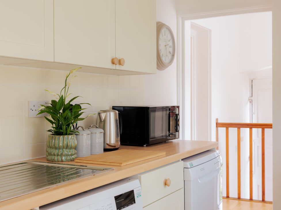 A kitchen with a kettle and microwave at Game Cottage in Bridgnorth