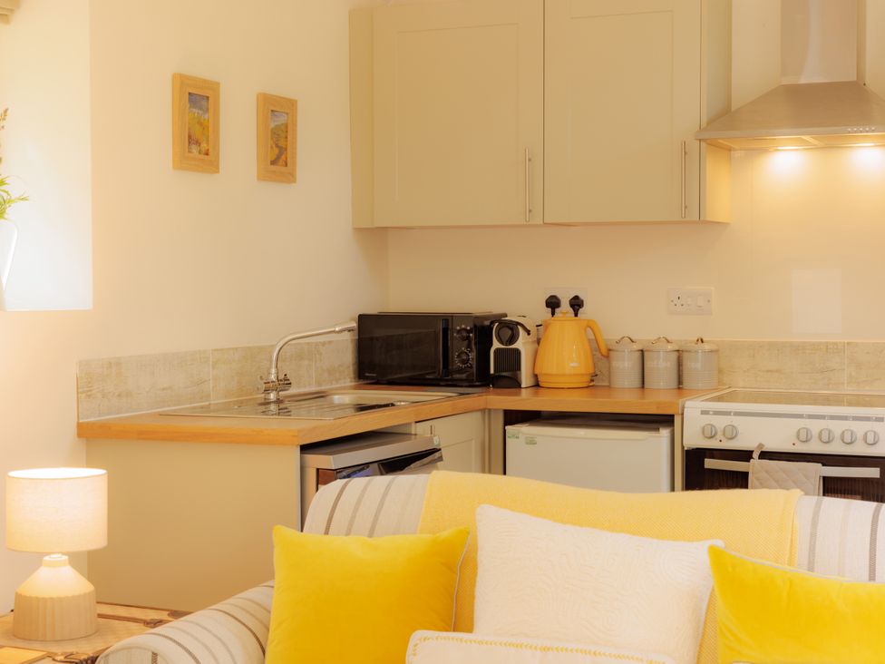 A kitchen with appliances and cabinetry at The Bothy in Bridgnorth