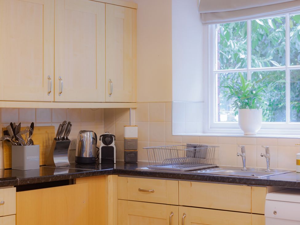 A kitchen with countertop appliances and utensils at Carriage Cottage in Worfield near Bridgnorth