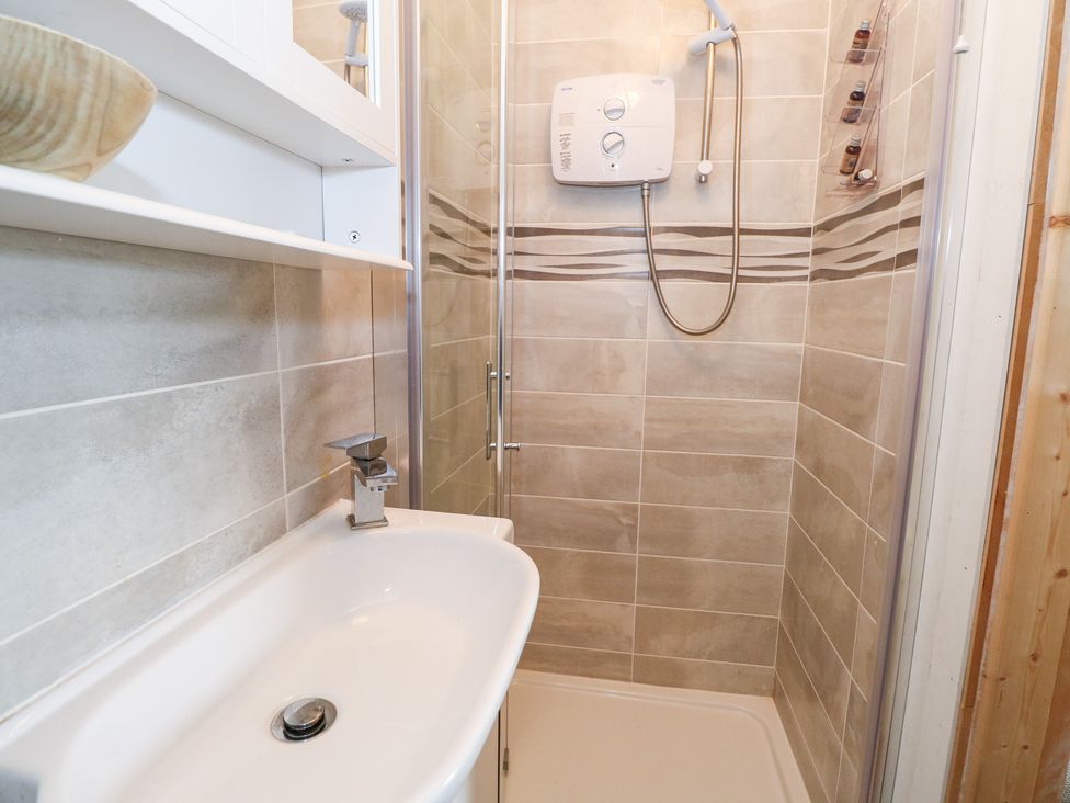 A bathroom with a sink and shower at Huath in Carrick on Shannon
