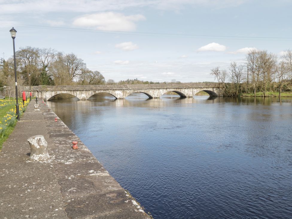 A river with a bridge and trees at Huath in Carrick on Shannon