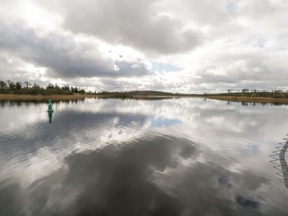 A lake with a buoy and reflections of clouds at Huath in Carrick on Shannon