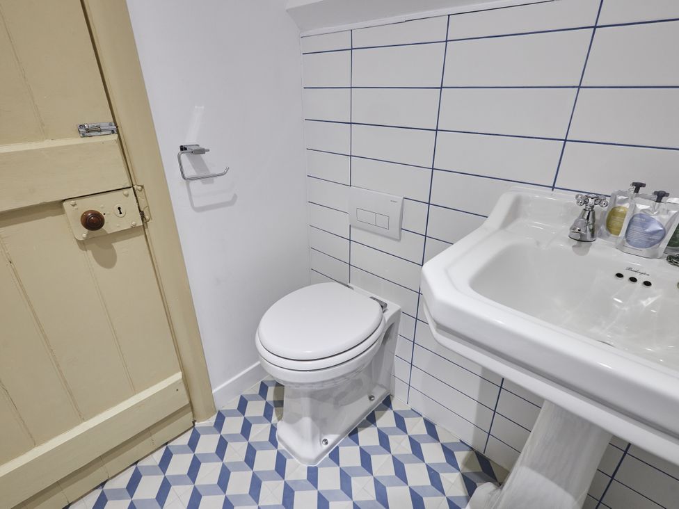 A bathroom with a toilet and sink at Beachside Cottage in Sandsend