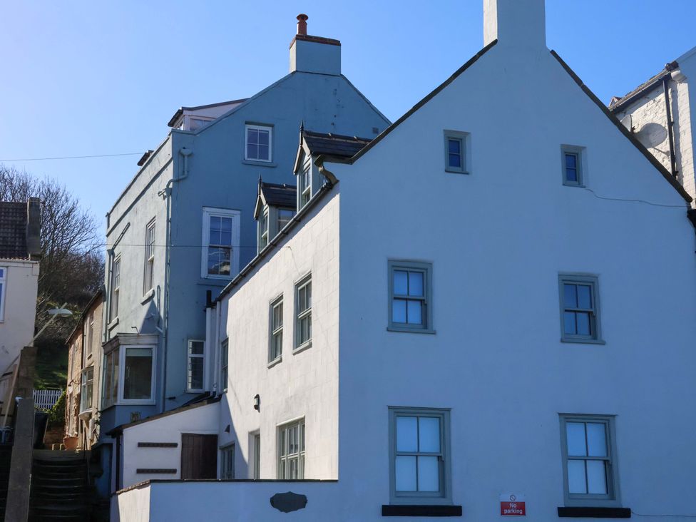 A house with multiple windows and stairs at Beachside Cottage in Sandsend
