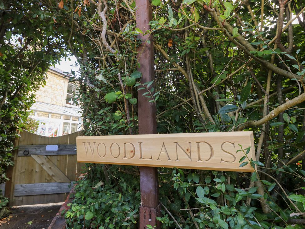 A wooden sign with the text 'WOODLANDS' at Woodlands in Freshwater