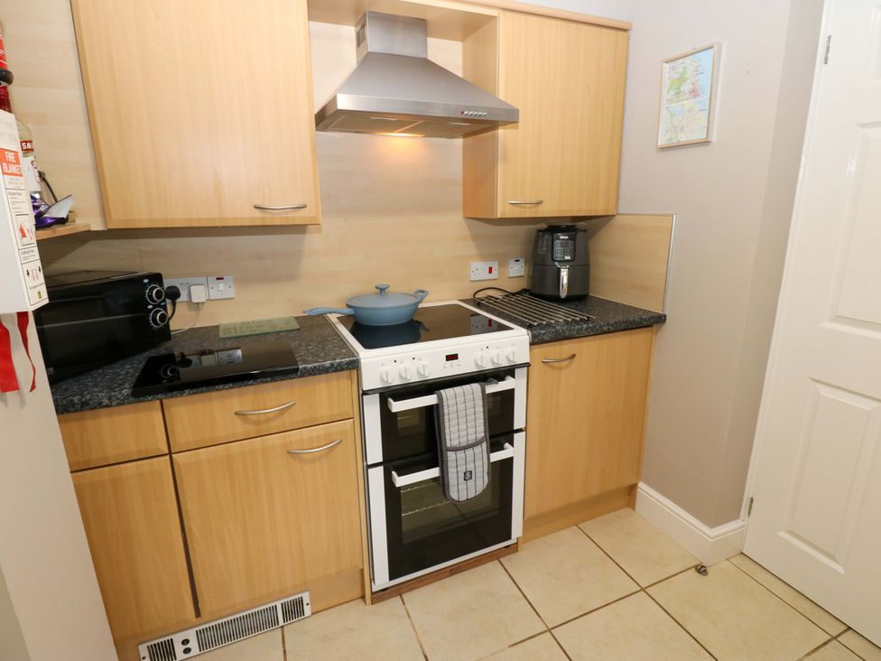 A kitchen with an oven, stove, and coffee machine at Amblers Rest in Amble