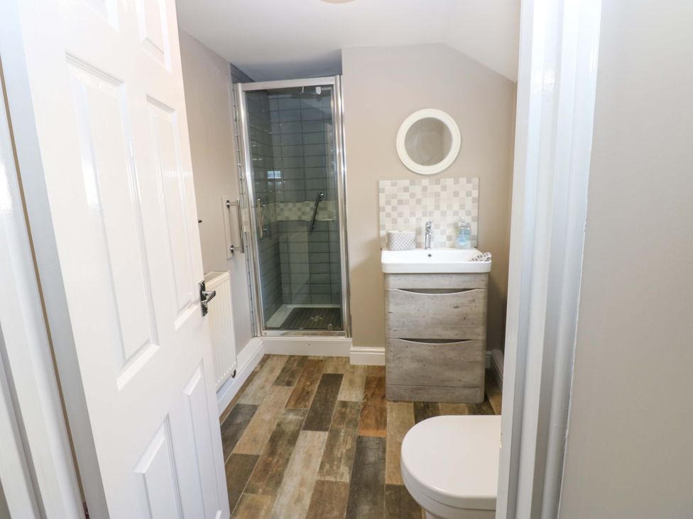 A bathroom with a shower and sink at Amblers Rest in Amble