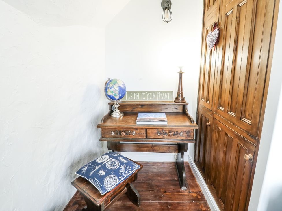A study with a desk and globe at The Old Cornmill in Cemaes Bay