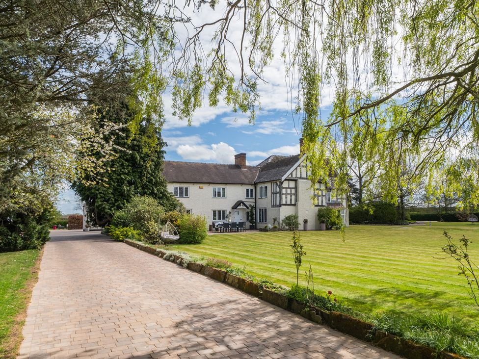 A house with a pathway and lawn at Hall O'Coole in Broomhall nearn Wrenbury