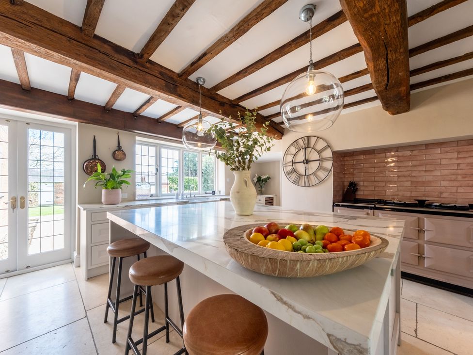 A kitchen with an island and a fruit bowl at Hall O'Coole in Broomhall nearn Wrenbury