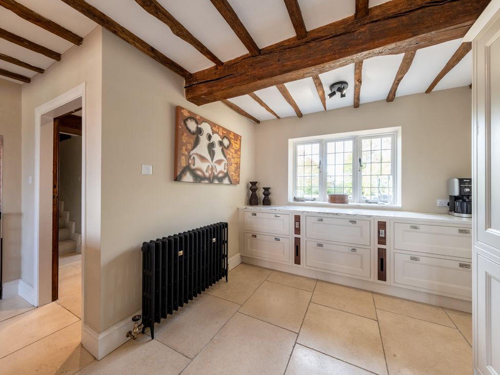 A kitchen with cupboards and a window at Hall O'Coole Broomhall nearn Wrenbury
