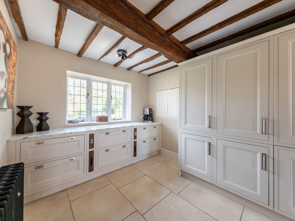 A kitchen with cabinets and a coffee maker at Hall O'Coole in Broomhall nearn Wrenbury