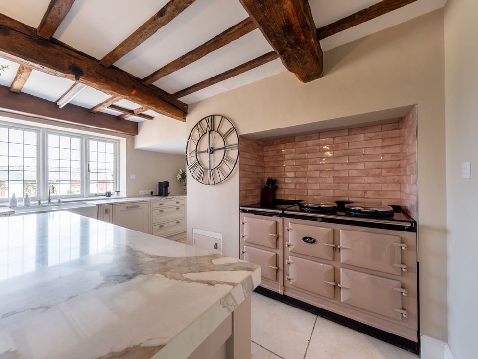 A kitchen with an oven and a sink at Hall O'Coole in Broomhall nearn Wrenbury