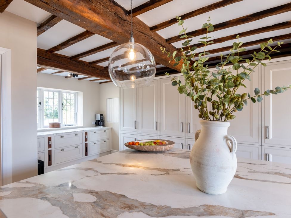 A kitchen with a countertop and cabinets at Hall O'Coole in Broomhall nearn Wrenbury