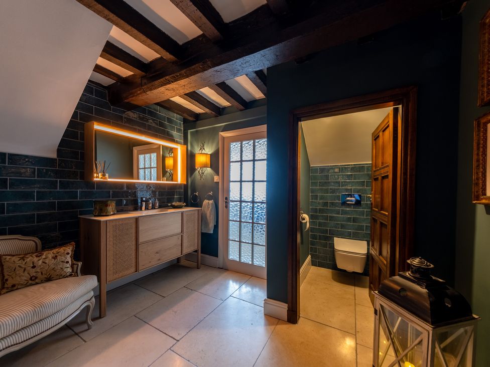 A bathroom with a wash basin and toilet at Hall O'Coole in Broomhall nearn Wrenbury