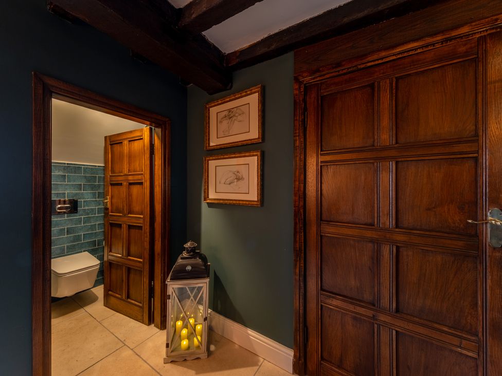 A bathroom with a door to a toilet at Hall O'Coole in Broomhall nearn Wrenbury