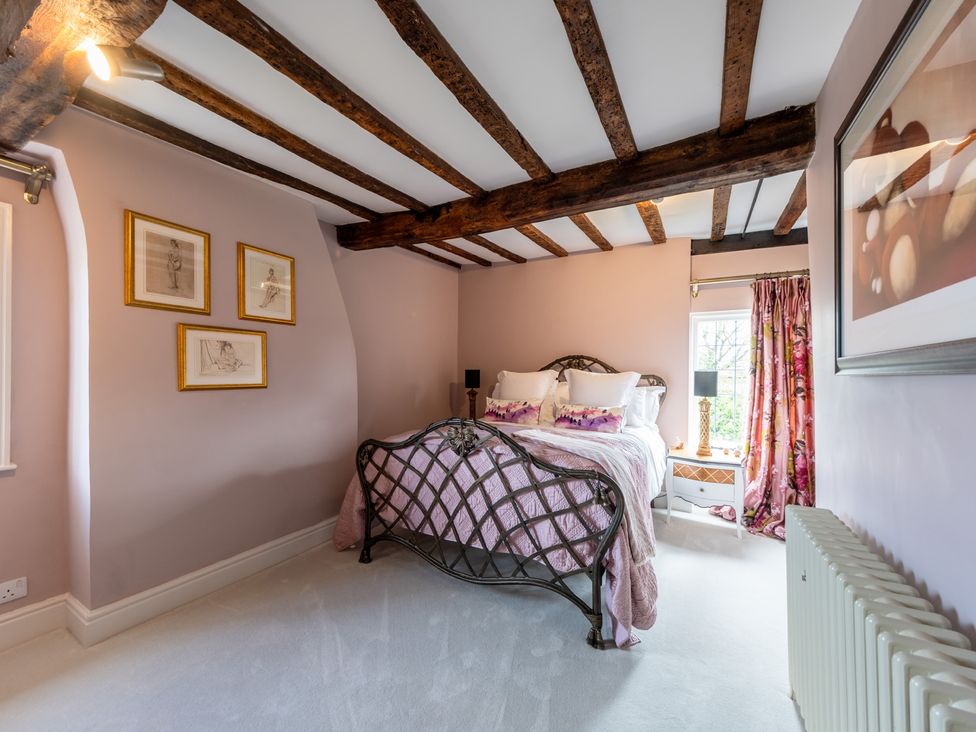A bedroom with a bed and nightstand at Hall O'Coole in Broomhall near Wrenbury