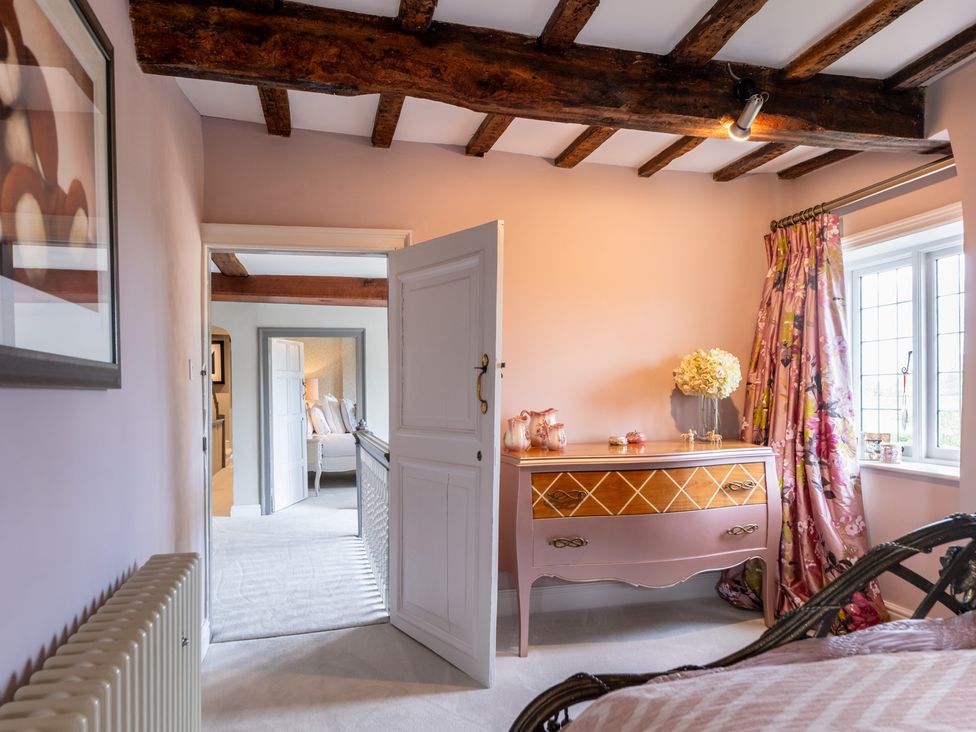 A bedroom with a dresser and a window at Hall O'Coole in Broomhall nearn Wrenbury