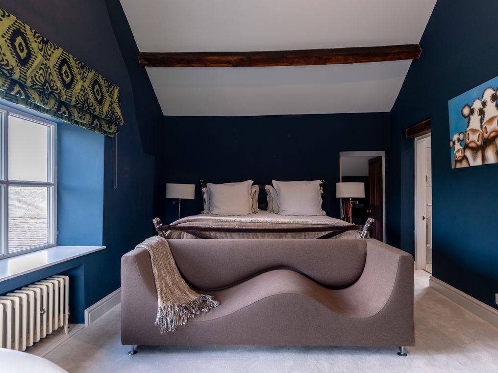 A bedroom with a bed and sofa at Hall O'Coole in Broomhall nearn Wrenbury