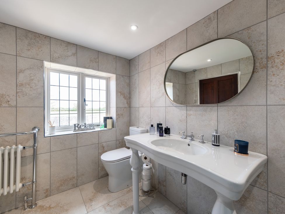 A bathroom with a sink and toilet at Hall O'Coole in Broomhall near Wrenbury