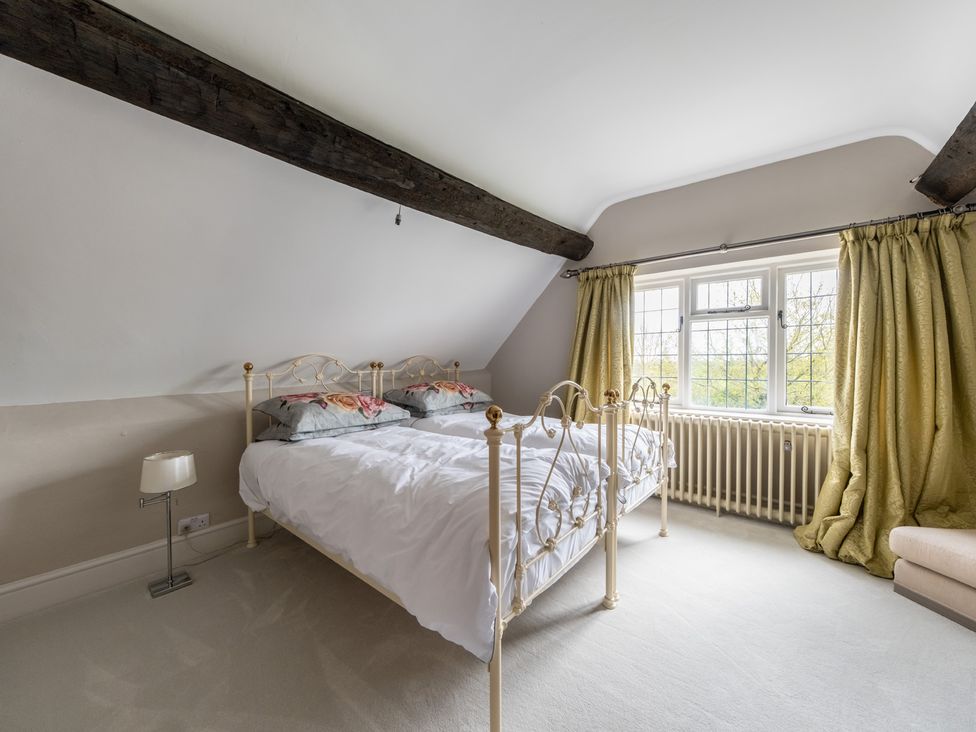 A bedroom with a bed and curtains at Hall O'Coole in Broomhall nearn Wrenbury