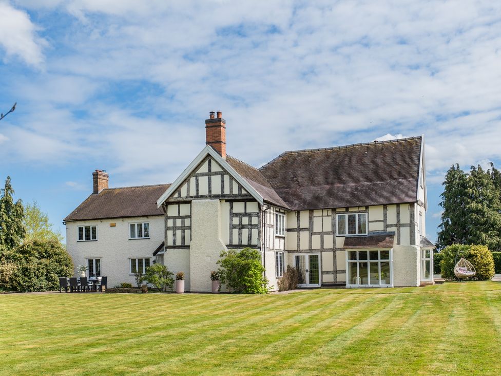 A house with a garden and patio at Hall O'Coole Broomhall nearn Wrenbury