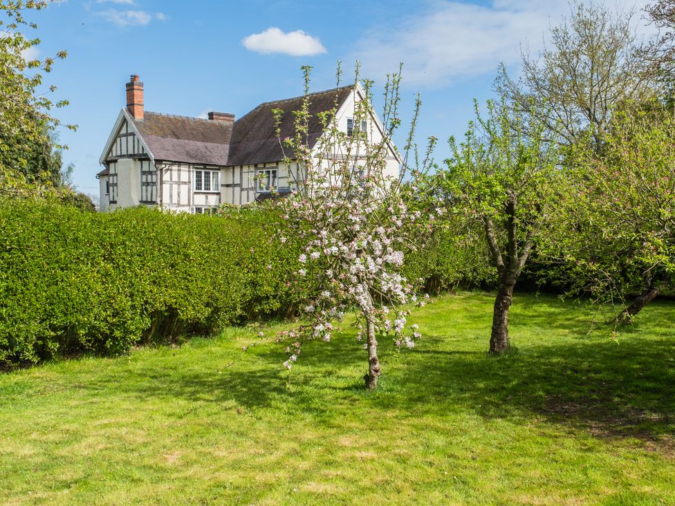 A house with a garden and trees at Hall O'Coole in Broomhall nearn Wrenbury