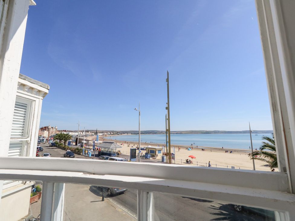 A beach view from a window at The Beach Condo in Weymouth