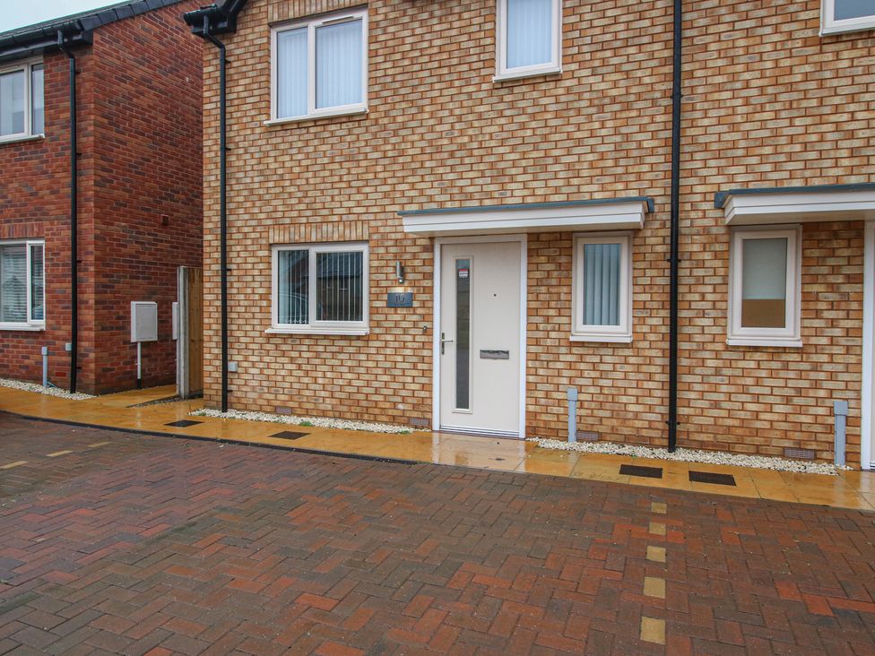 An entrance view of a house with a door and windows at 10 The Colliery Telford