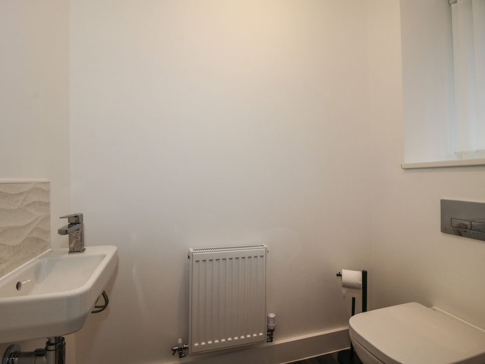 A bathroom with a sink and toilet at 10 The Colliery Telford