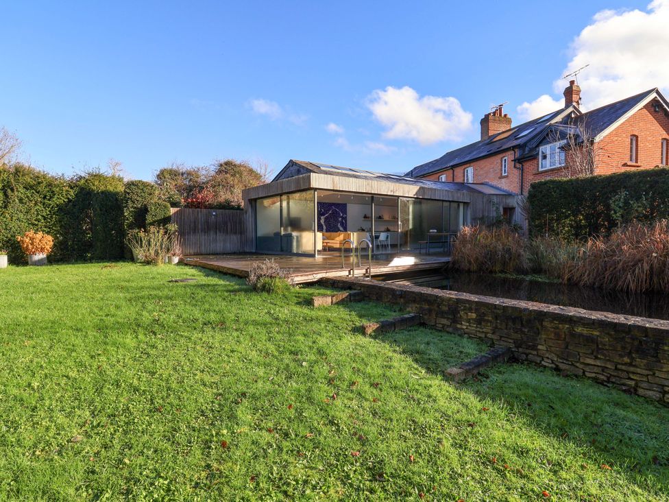 A house and garden area at 2 Bredy Cottages in Burton Bradstock
