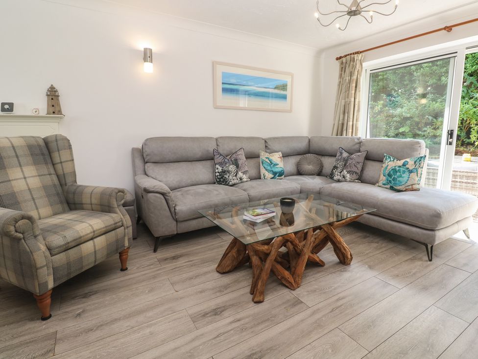 A living room with a sofa and coffee table at Jaluna in Carbis Bay