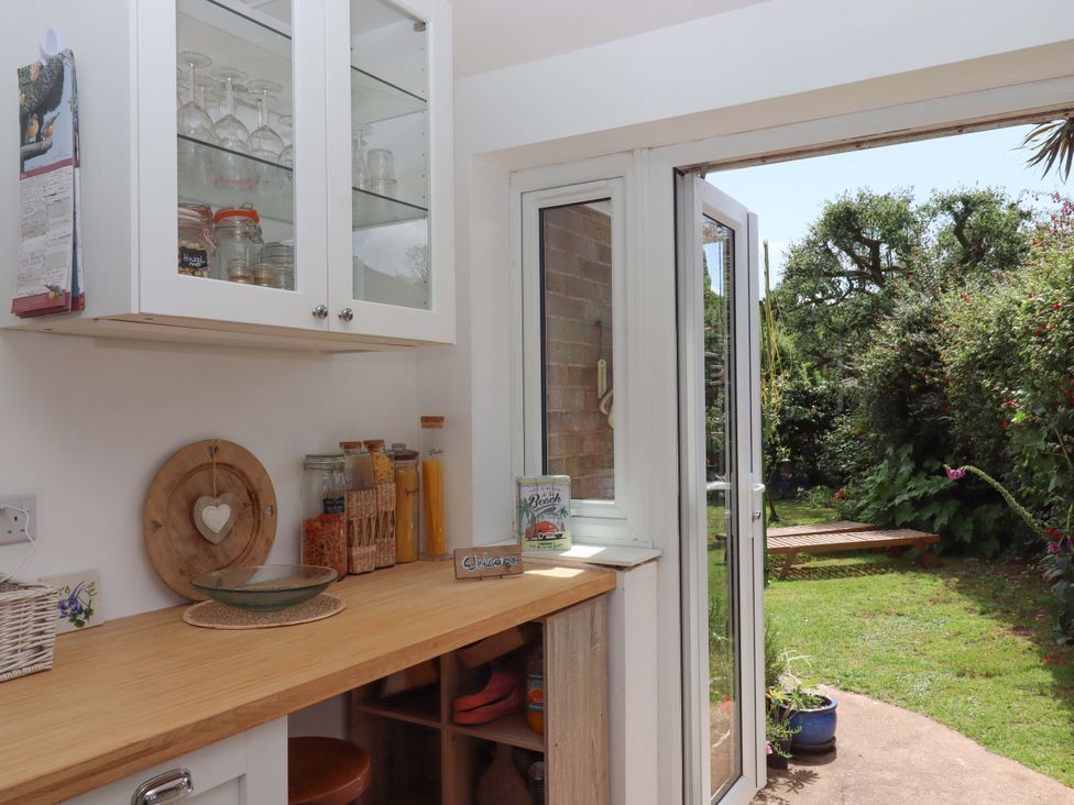 A kitchen with glassware and jars at Rowan in Brixham