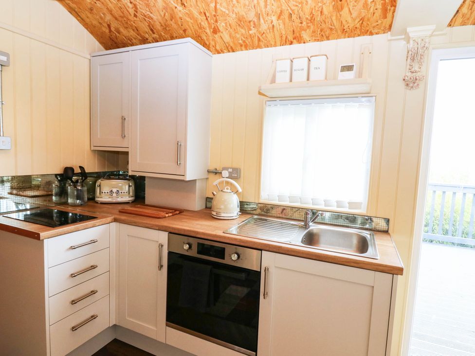 A kitchen with a sink and countertop at Masons Hut in West Mains near Haggerston