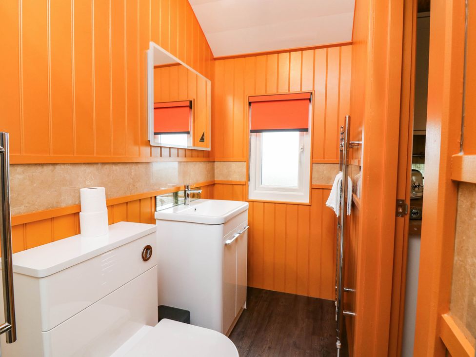 A bathroom with toilet and sink at Masons Hut in West Mains near Haggerston