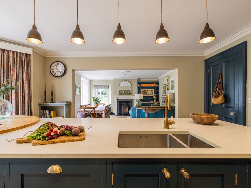 A kitchen with vegetables on a countertop at The Old Vicarage in Merriott