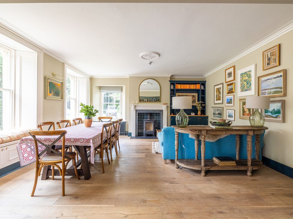 A dining room with a table and chairs at The Old Vicarage in Merriott