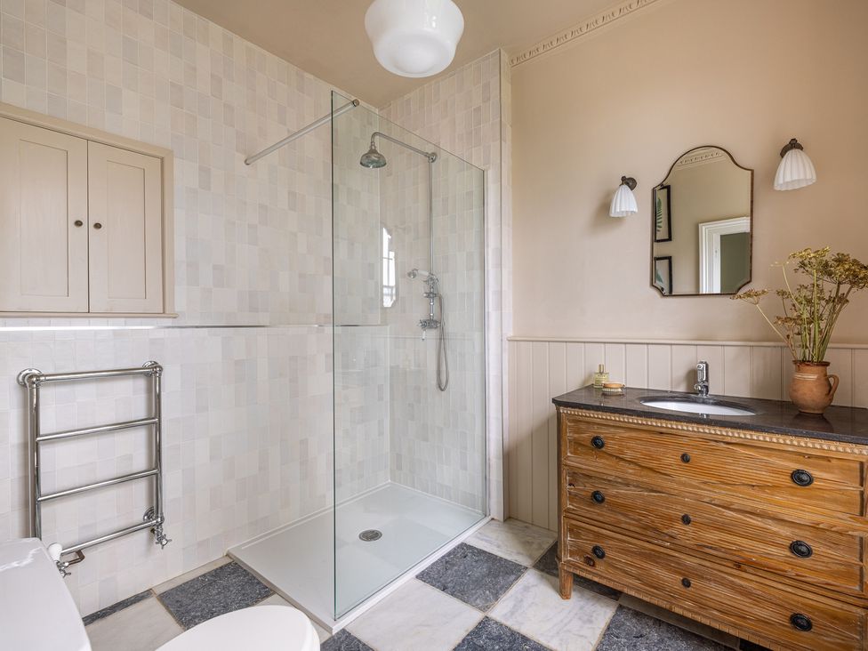 A bathroom with a shower and sink at The Old Vicarage in Merriott