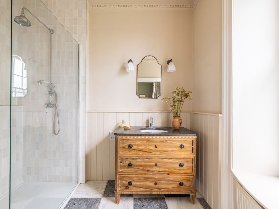 A bathroom with a shower and sink at The Old Vicarage in Merriott