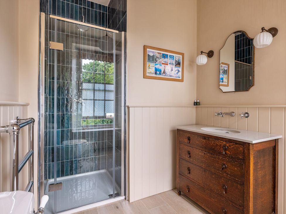 A bathroom with a shower, sink, and toilet at The Old Vicarage in Merriott