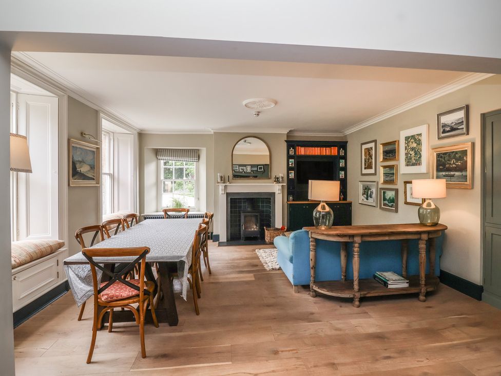 A dining room with a table and chairs at The Old Vicarage in Merriott