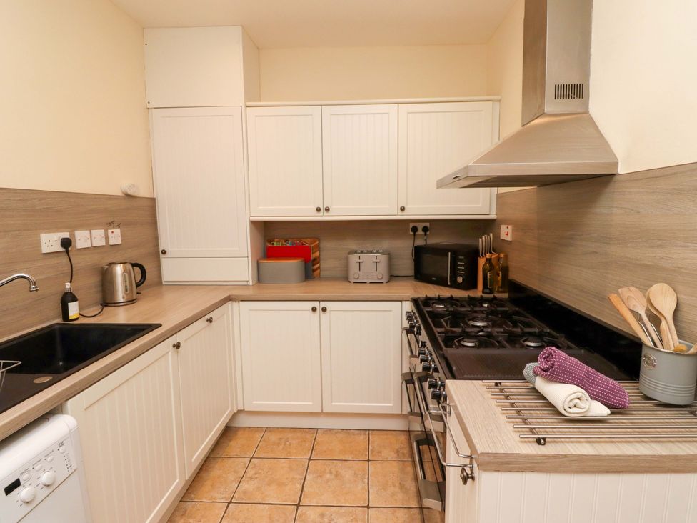 A kitchen with appliances and utensils at Barleycorn Cottage in Belford