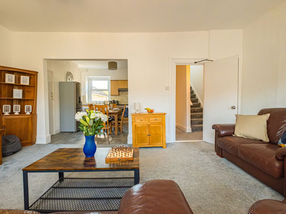 A living room with a sofa and coffee table at Flat 56 Newton Road Abertawe