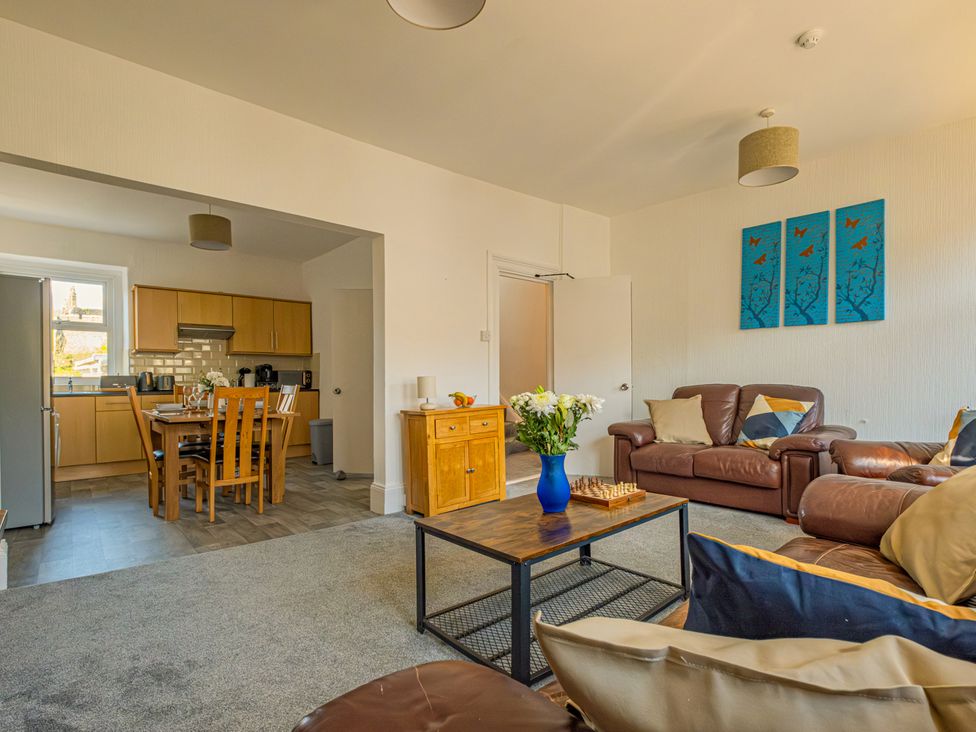 A living room with a sofa and coffee table at Flat 56 Newton Road Abertawe