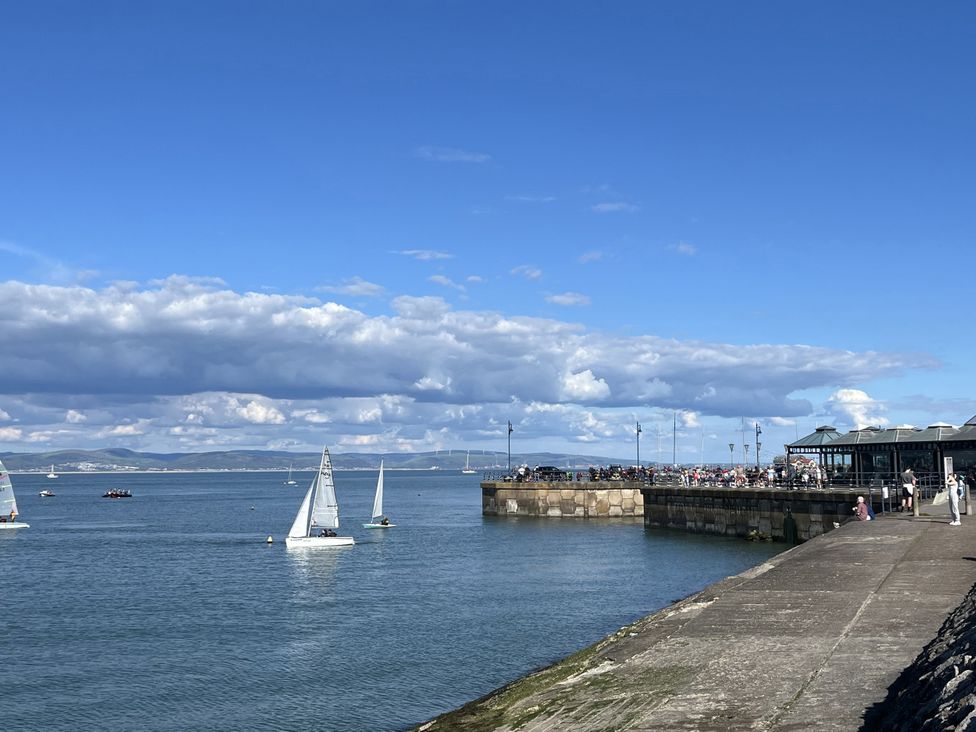 Sailboats on water near a pier at Flat 56 Newton Road Abertawe
